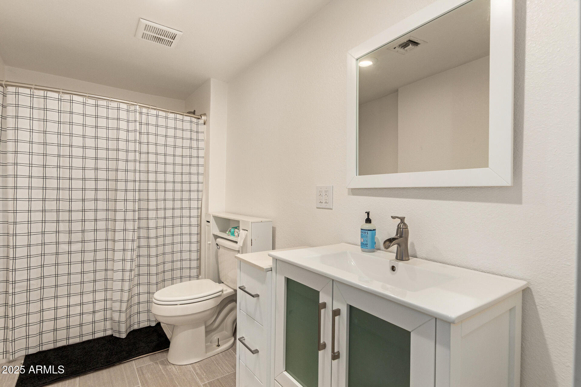 1221 East Alta Vista Road Phoenix, AZ 85042 - Photo 25 of 33 a bathroom with a sink toilet and shower