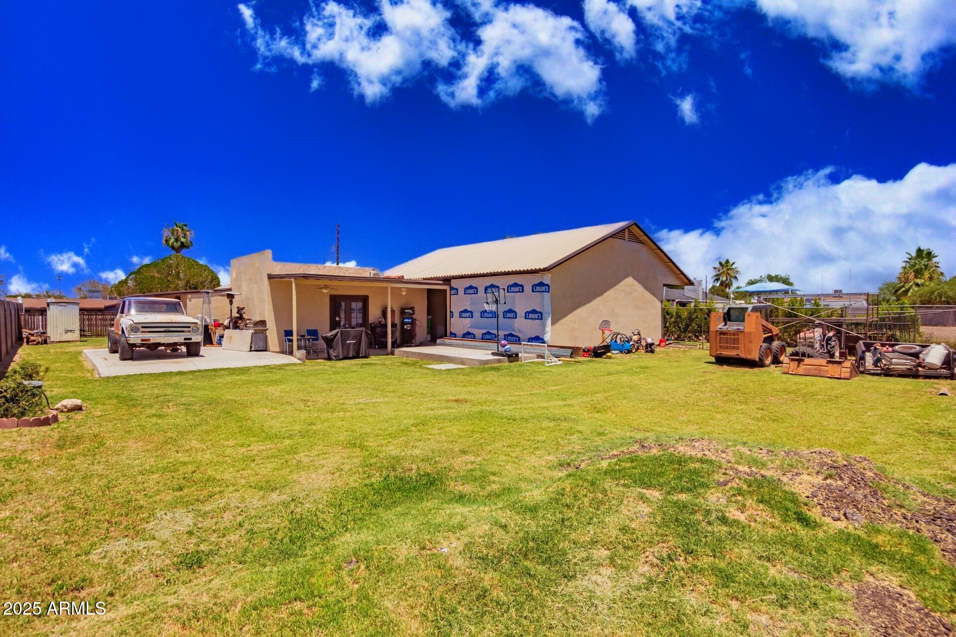 1221 East Alta Vista Road Phoenix, AZ 85042 - Photo 31 of 33 a aerial view of a house with swimming pool