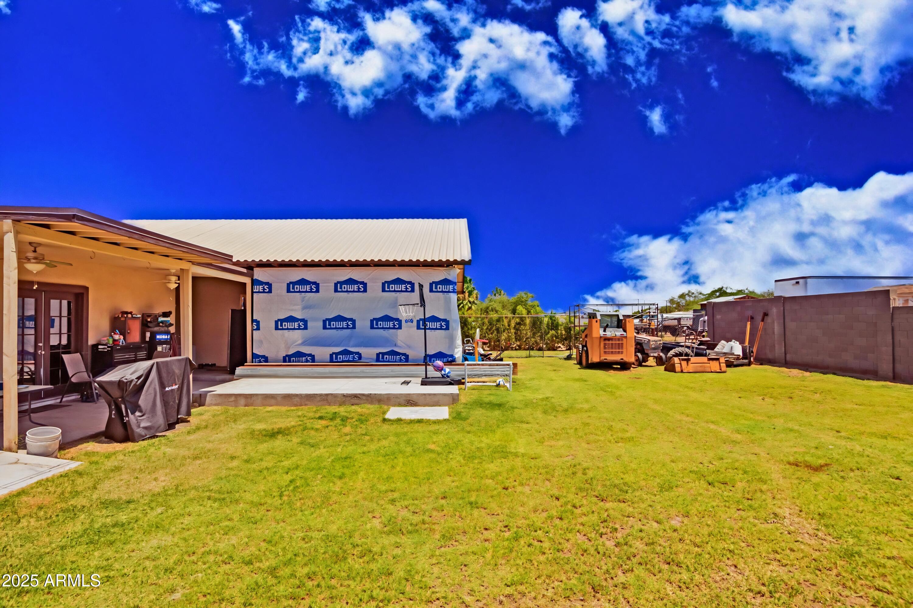 1221 East Alta Vista Road Phoenix, AZ 85042 - Photo 32 of 33 a swimming pool with outdoor seating and yard