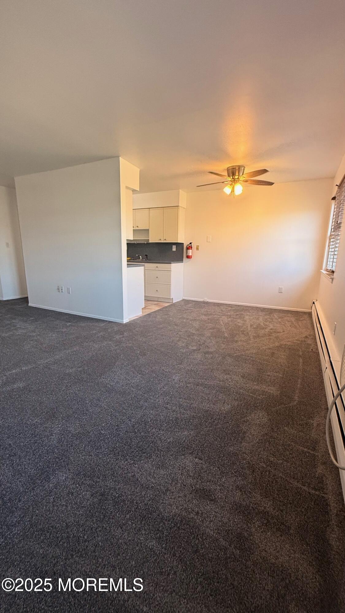 76 Manchester Court, Unit H Freehold, NJ 07728 - Photo 3 of 10 a view of an empty room