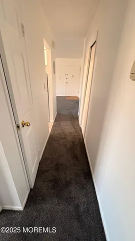 a kitchen with a refrigerator sink and cabinets