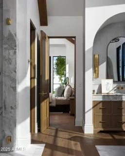 a en suite bathroom with a sink and a mirror