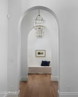 a view of a hallway with a chandelier