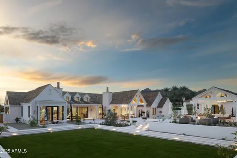 a front view of a residential apartment building with a yard