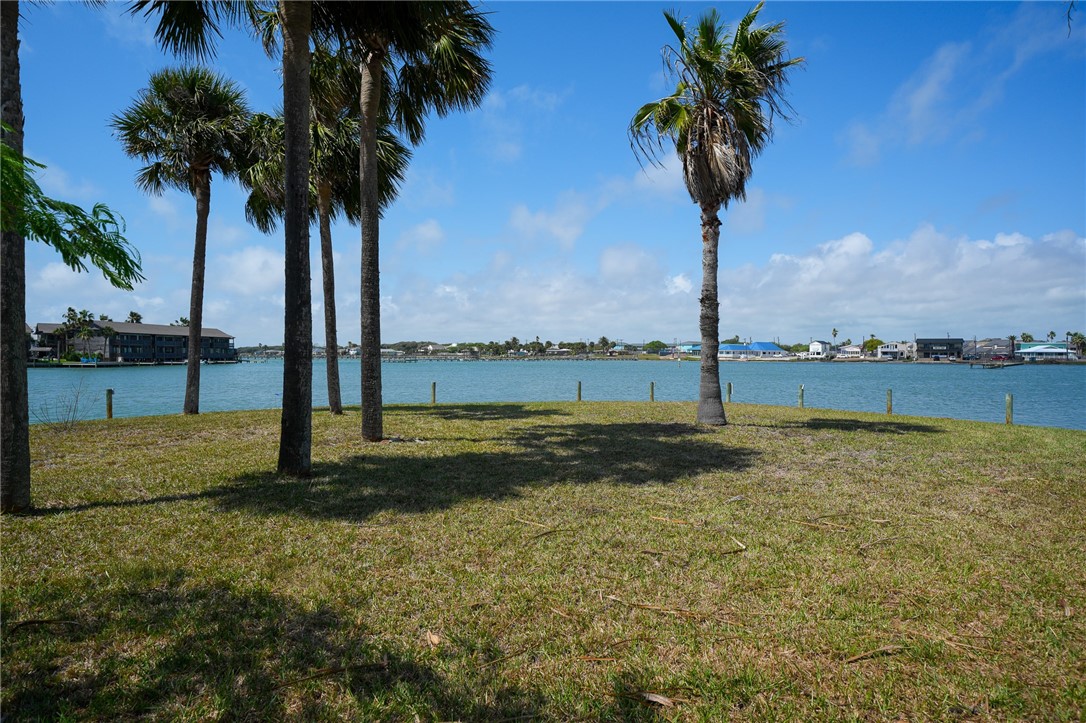 37 Riviera Drive Rockport, TX 78382 - Photo 1 of 16 a view of a yard with palm trees