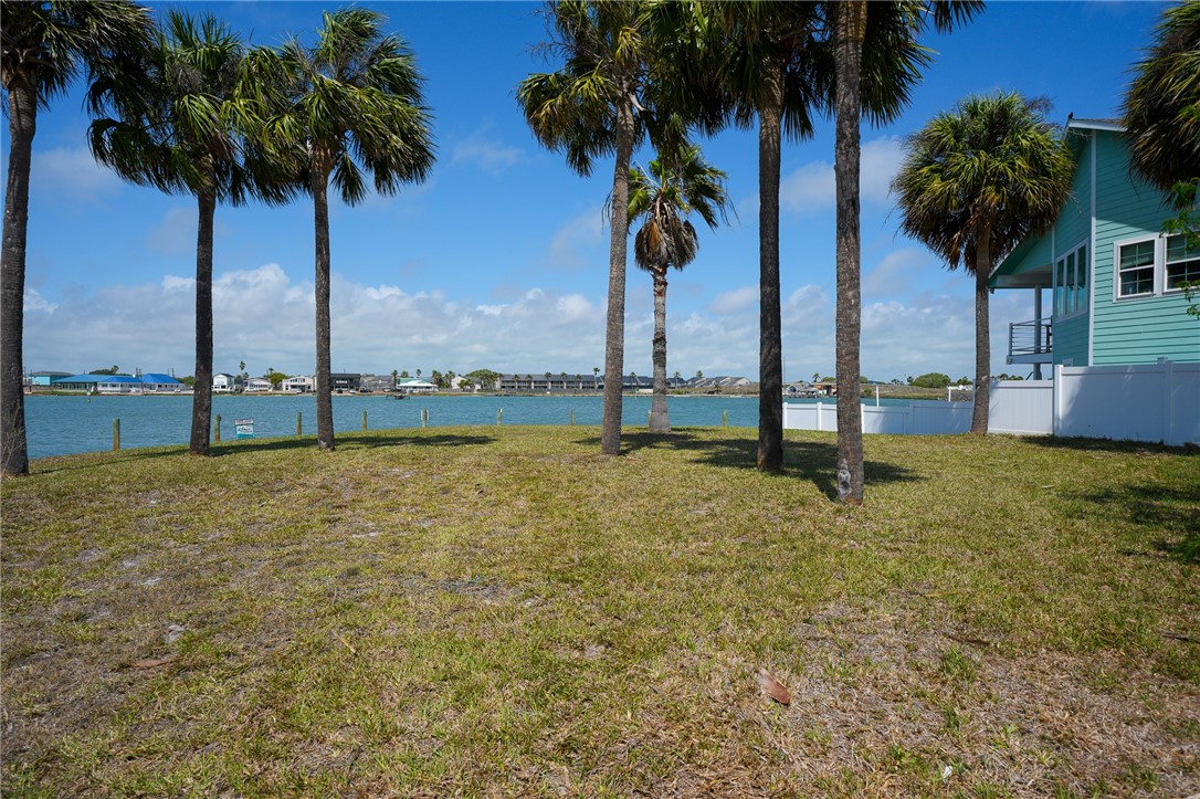 37 Riviera Drive Rockport, TX 78382 - Photo 2 of 16 a view of an ocean with palm trees