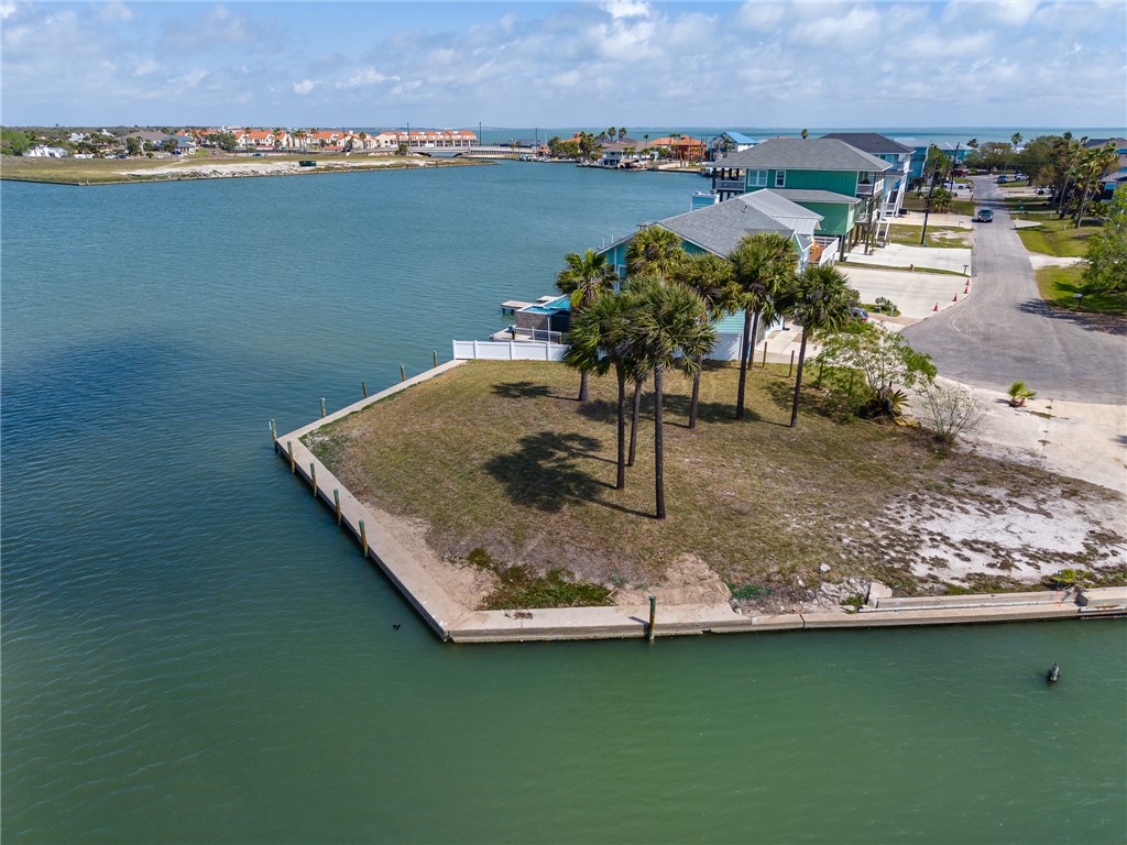 37 Riviera Drive Rockport, TX 78382 - Photo 8 of 16 a view of a lake with a building in the background