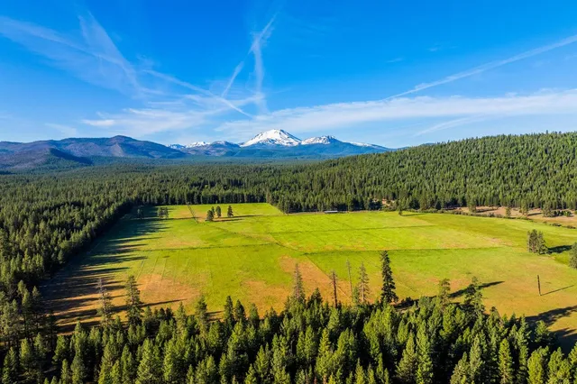 a view of a swimming pool with an ocean view