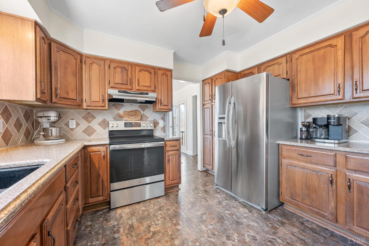 3520 Roaring Run Road Goode, VA 24556 - Photo 11 of 68 a kitchen with stainless steel appliances granite countertop a refrigerator stove and sink
