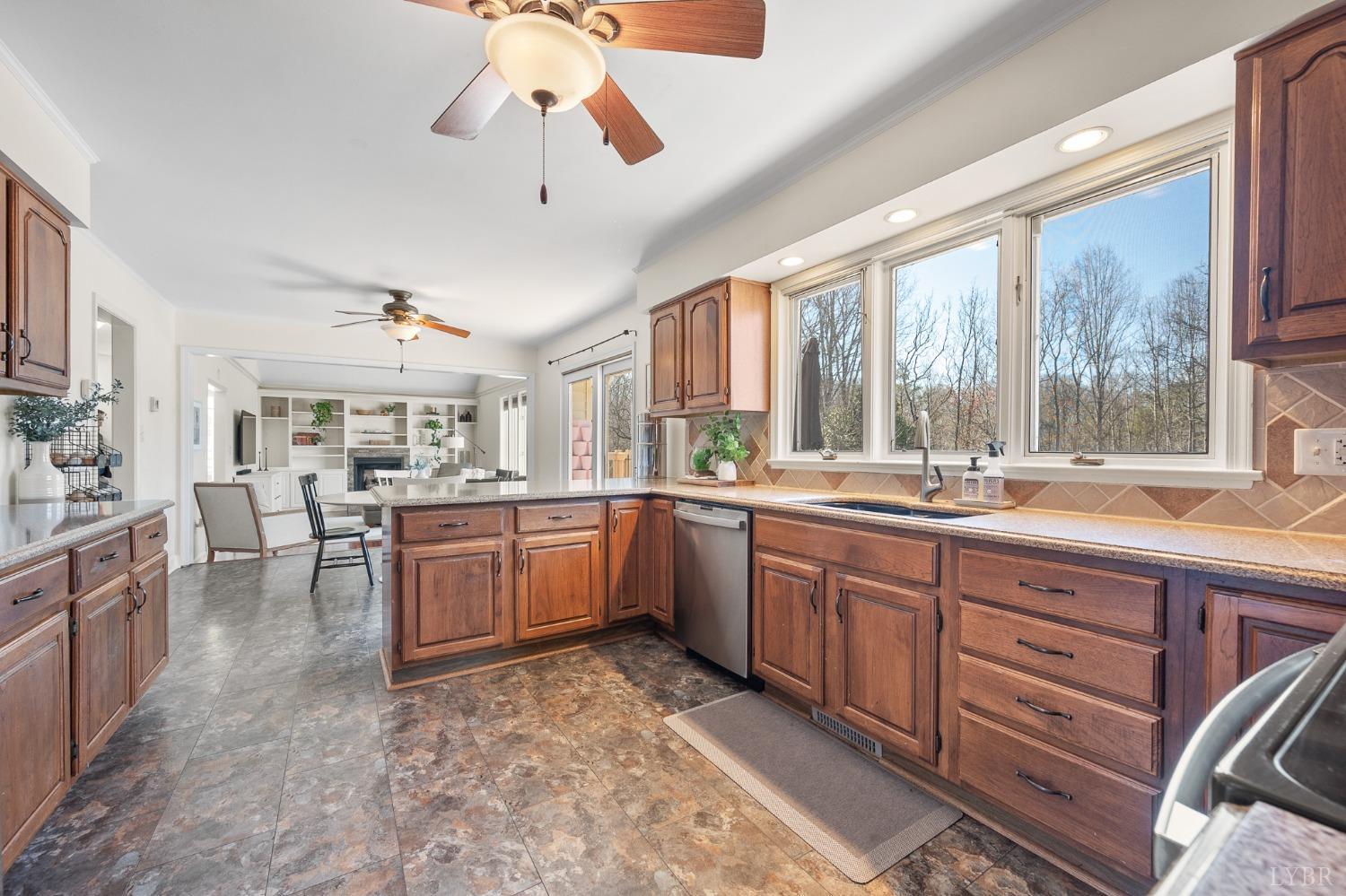 3520 Roaring Run Road Goode, VA 24556 - Photo 13 of 68 a kitchen with sink cabinets and dining table