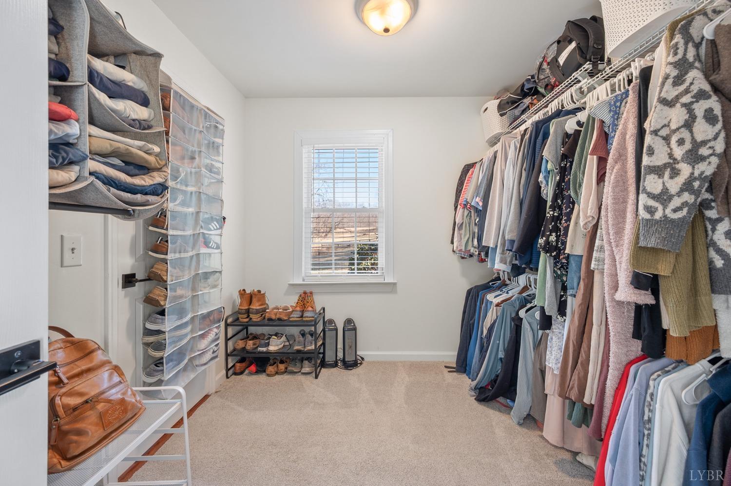 3520 Roaring Run Road Goode, VA 24556 - Photo 29 of 68 a view of walk in closet with clothes and shoes