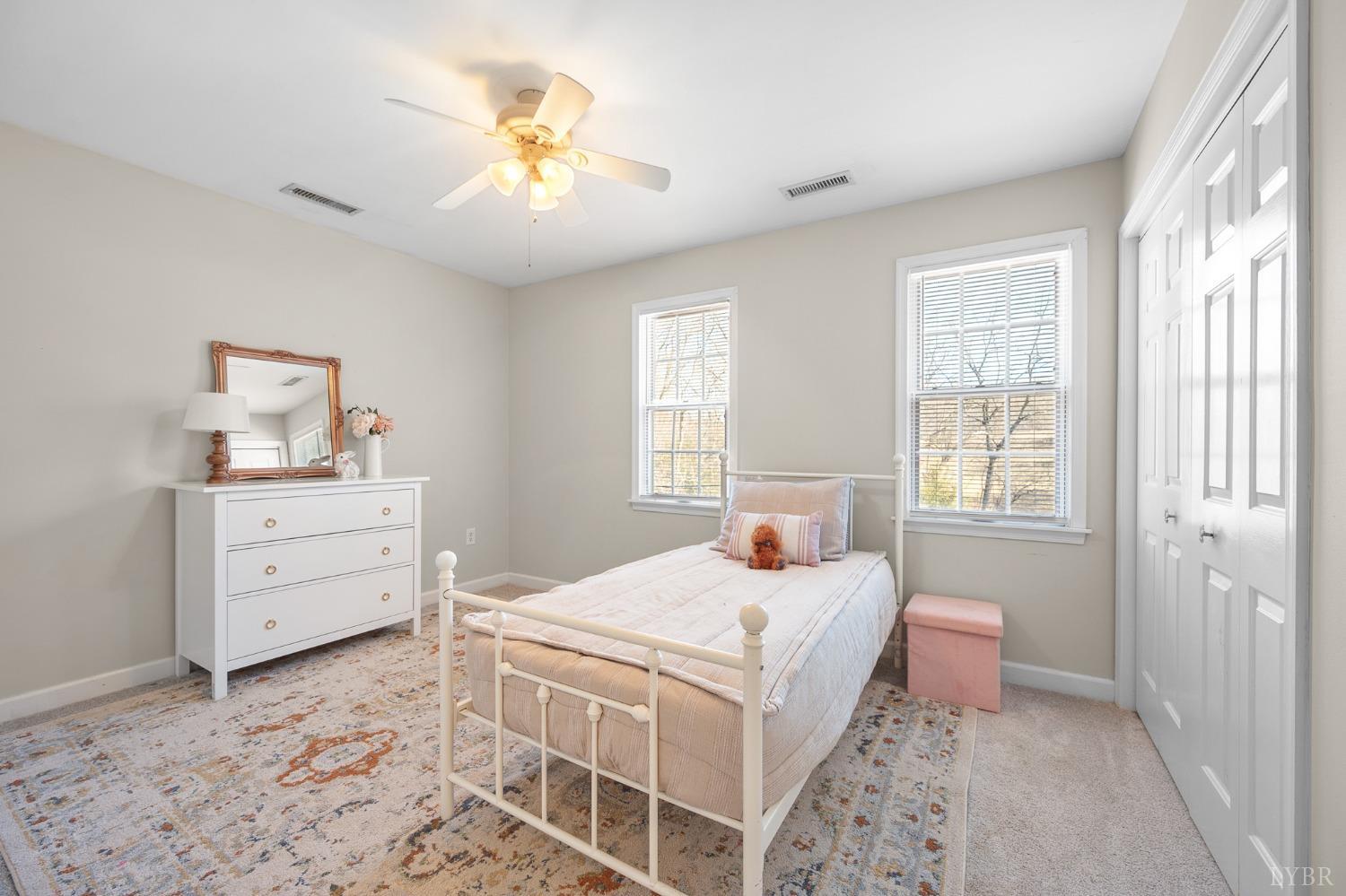 3520 Roaring Run Road Goode, VA 24556 - Photo 46 of 68 a bedroom with a bed and a dresser in it