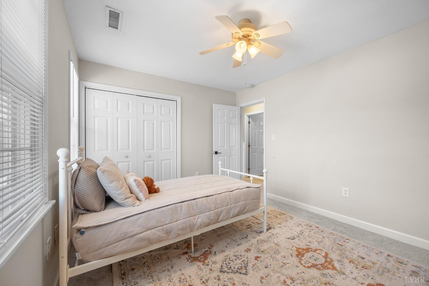 3520 Roaring Run Road Goode, VA 24556 - Photo 47 of 68 a bedroom with a bed and a window