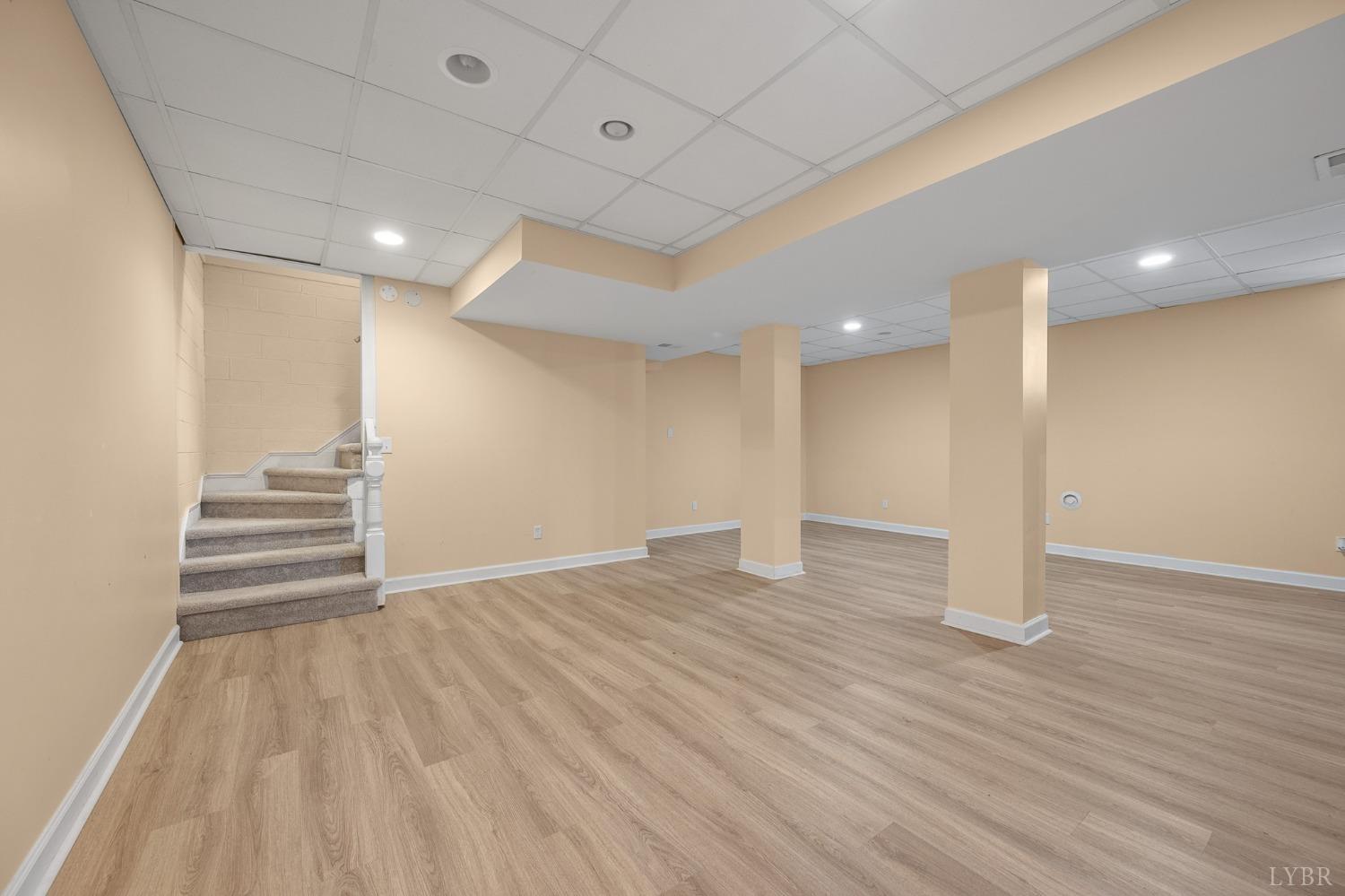 3520 Roaring Run Road Goode, VA 24556 - Photo 49 of 68 a view of an empty room with wooden floor