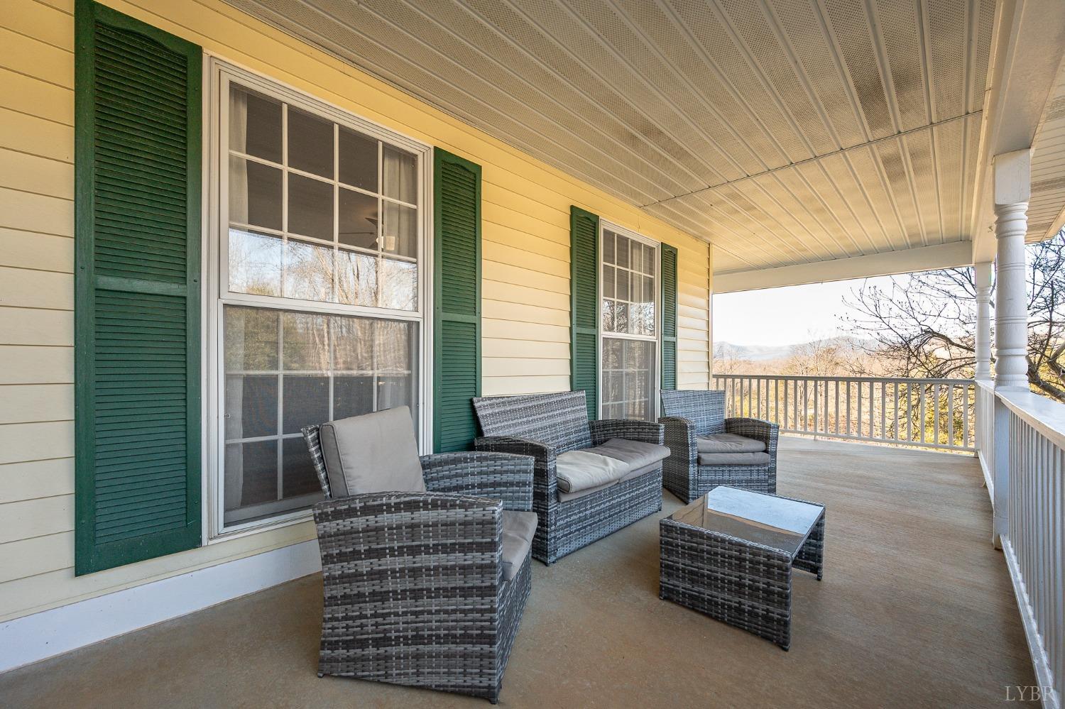 3520 Roaring Run Road Goode, VA 24556 - Photo 55 of 68 a view of outdoor living space with furniture and windows