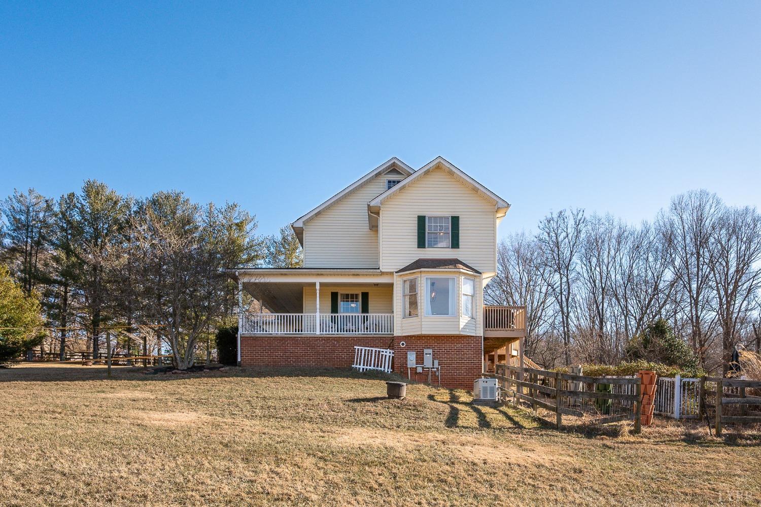 3520 Roaring Run Road Goode, VA 24556 - Photo 62 of 68 a front view of a house with a yard