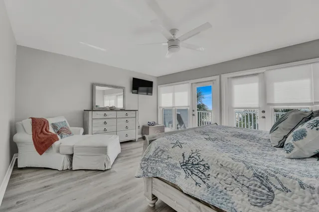 a bedroom with a bed and a couch