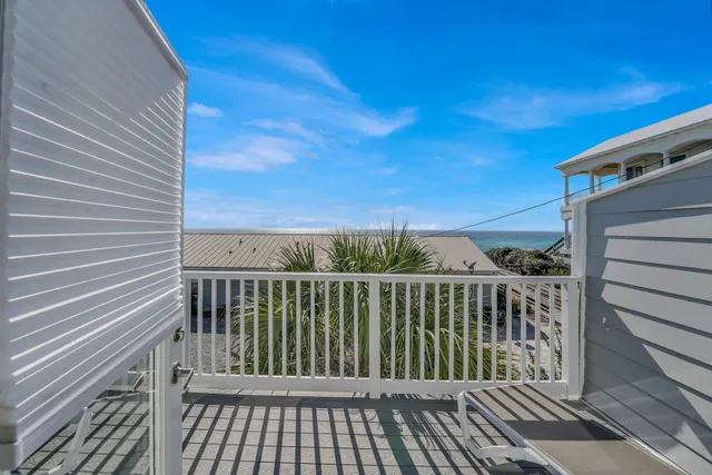 a view of a balcony with wooden floor