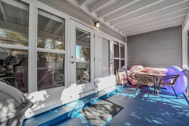a backyard of a house with table and chairs
