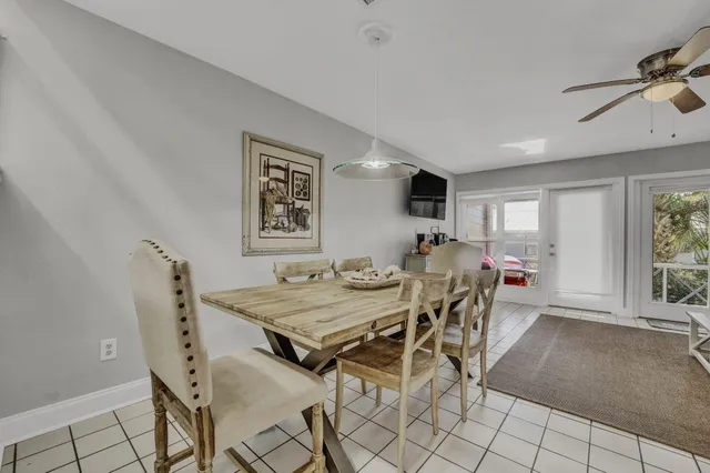 a view of a dining room with furniture and window