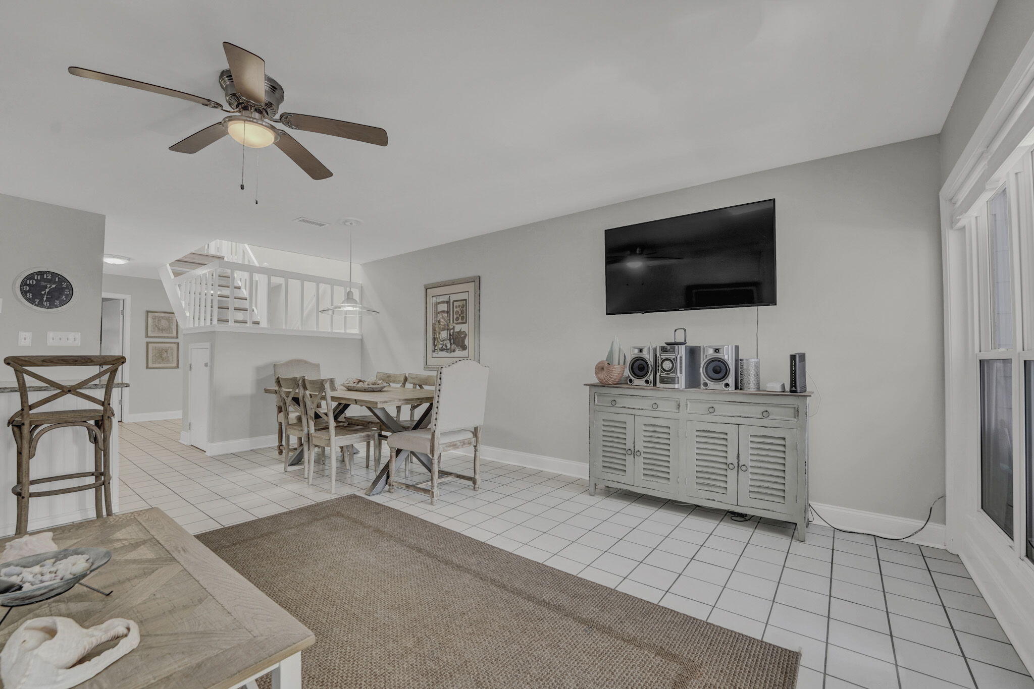 8046 East County Highway 30A Inlet Beach, FL 32461 - Photo 7 of 36 a living room with furniture and a flat screen tv