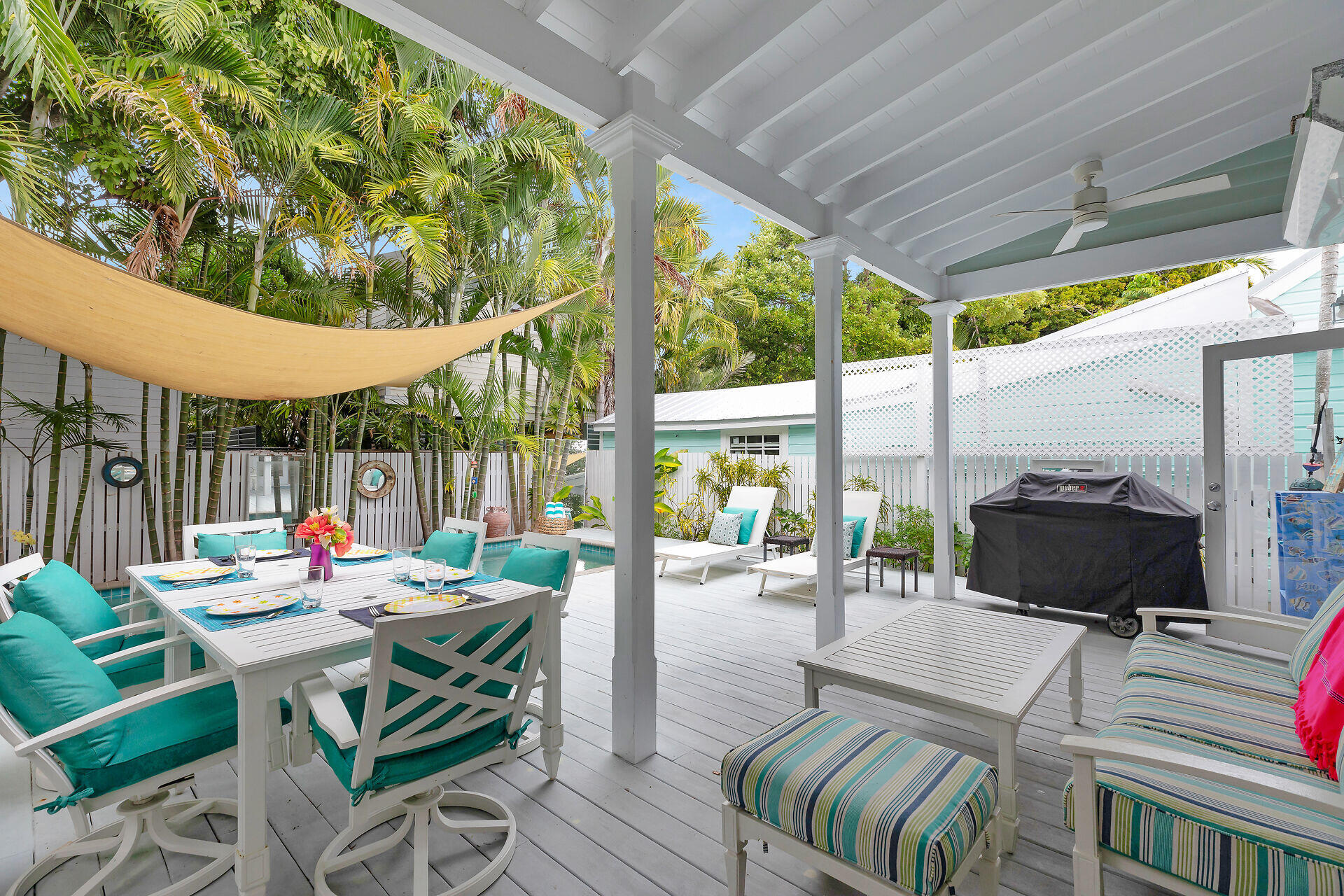 1309 Petronia Street Key West, FL 33040 - Photo 21 of 38 a outdoor space with the couches and dining table with the garden view