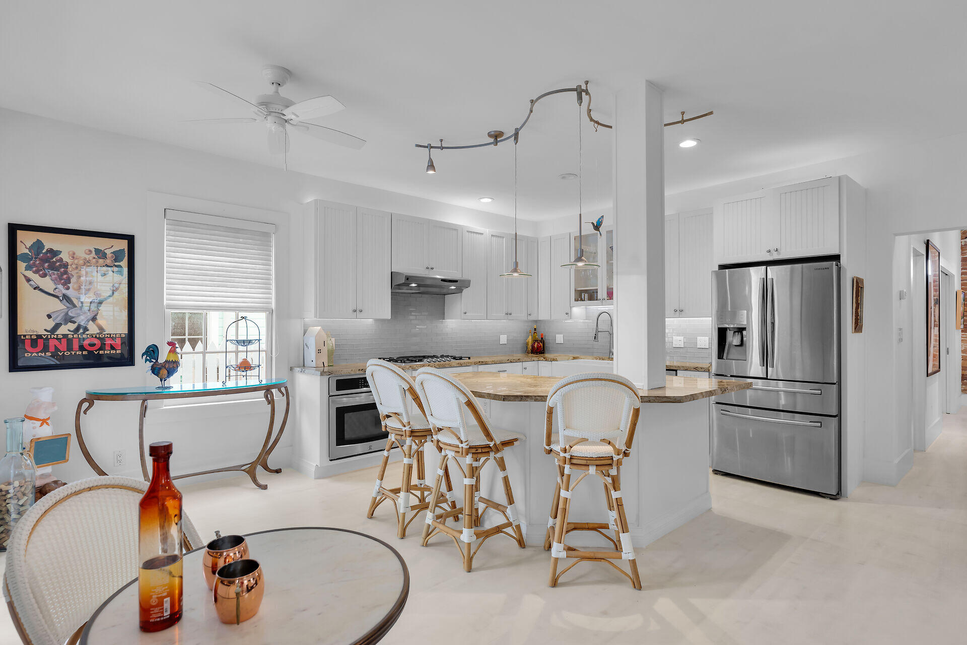 1309 Petronia Street Key West, FL 33040 - Photo 5 of 38 a kitchen with stainless steel appliances granite countertop a dining table chairs refrigerator and cabinets