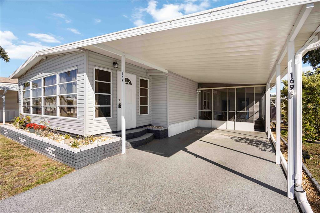 10303 Burnt Store Road, Unit 169 Punta Gorda, FL 33950 - Photo 2 of 34 a front view of a house with windows