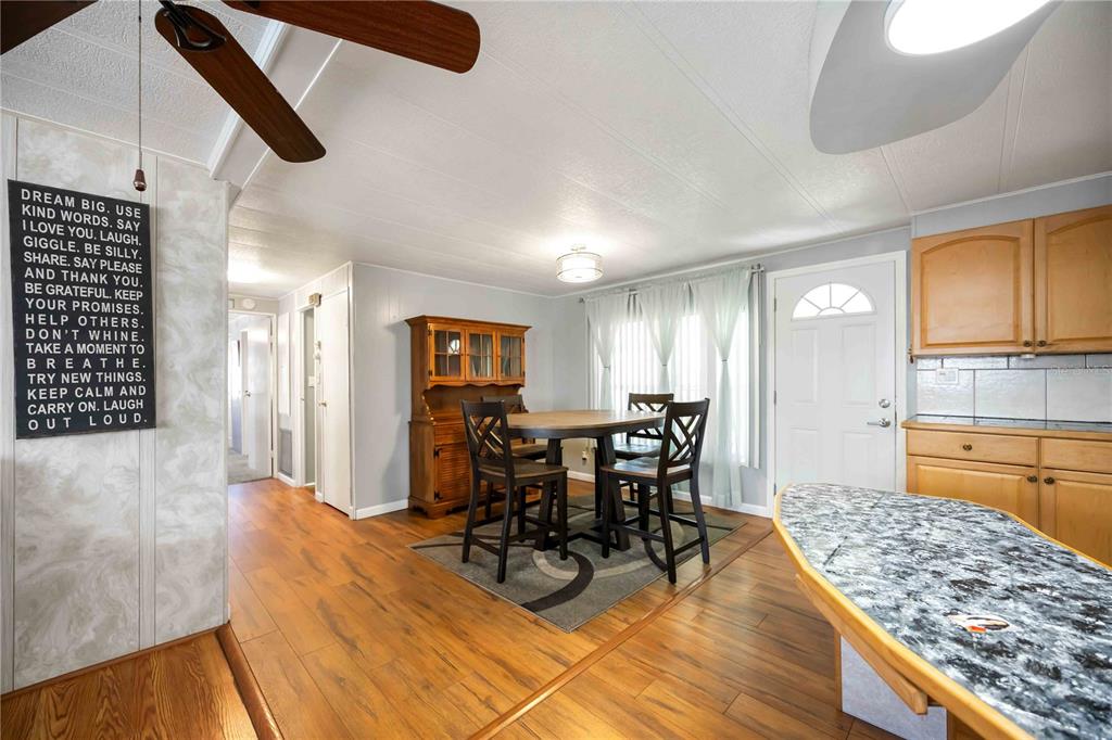 10303 Burnt Store Road, Unit 169 Punta Gorda, FL 33950 - Photo 8 of 34 a view of a dining room with furniture