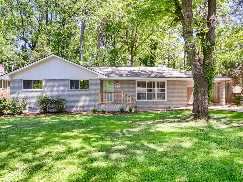 1115 Franklin Circle Northeast Atlanta, GA 30324 - Photo 1 of 1 a front view of a house with a garden