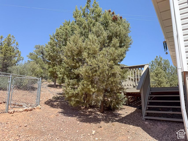 425 East Mule Deer Road Central, UT 84722 - Photo 66 of 72 View of yard featuring a wooden deck, stairs, and a gate