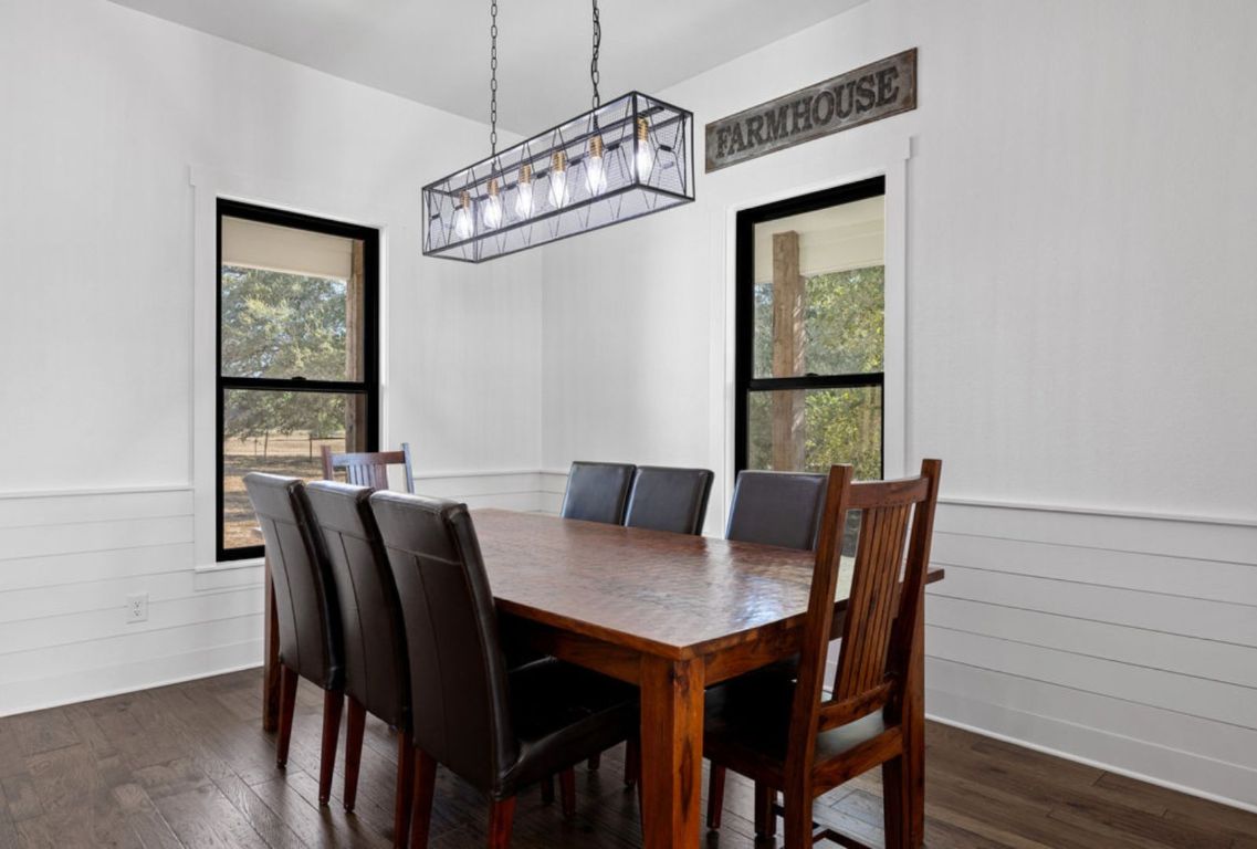 340 Mark Young Road Smithville, TX 78957 - Photo 17 of 40 a view of a dining room with furniture window and wooden floor