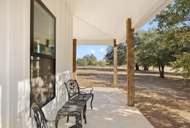 a view of a porch with chairs