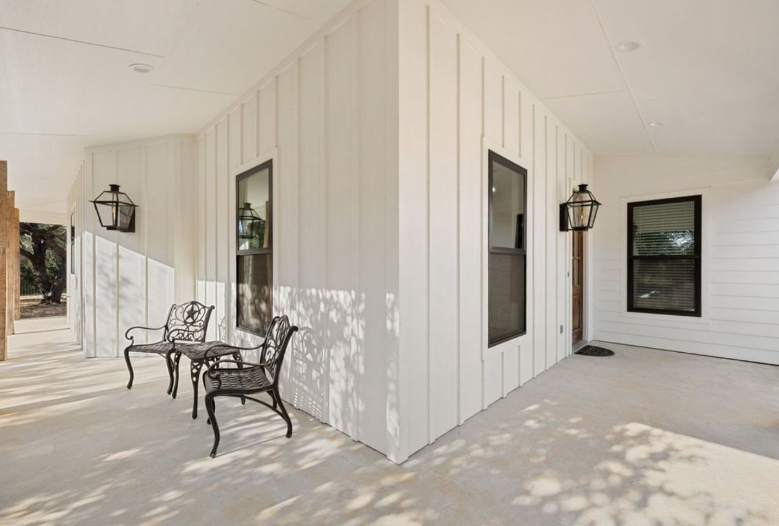 340 Mark Young Road Smithville, TX 78957 - Photo 8 of 40 a view of a livingroom with furniture and entryway wooden floor windows