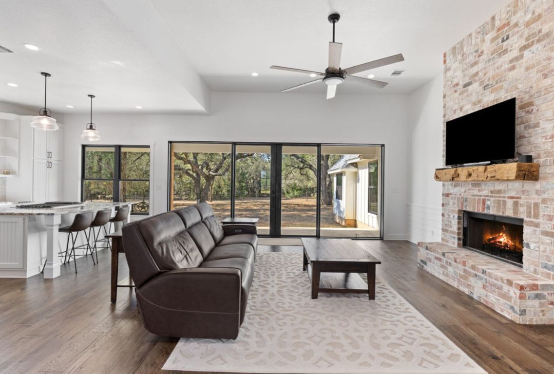 340 Mark Young Road Smithville, TX 78957 - Photo 9 of 40 a living room with furniture fireplace and flat screen tv