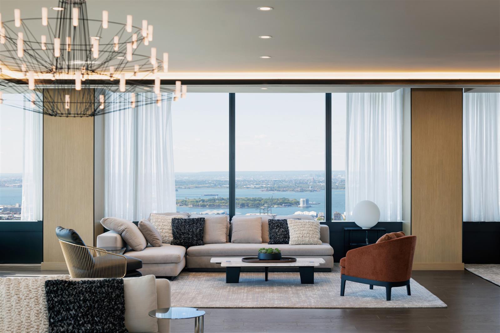 18 6th Avenue, Unit 711 Brooklyn, NY 11217 - Photo 20 of 35 a living room with furniture and a floor to ceiling window