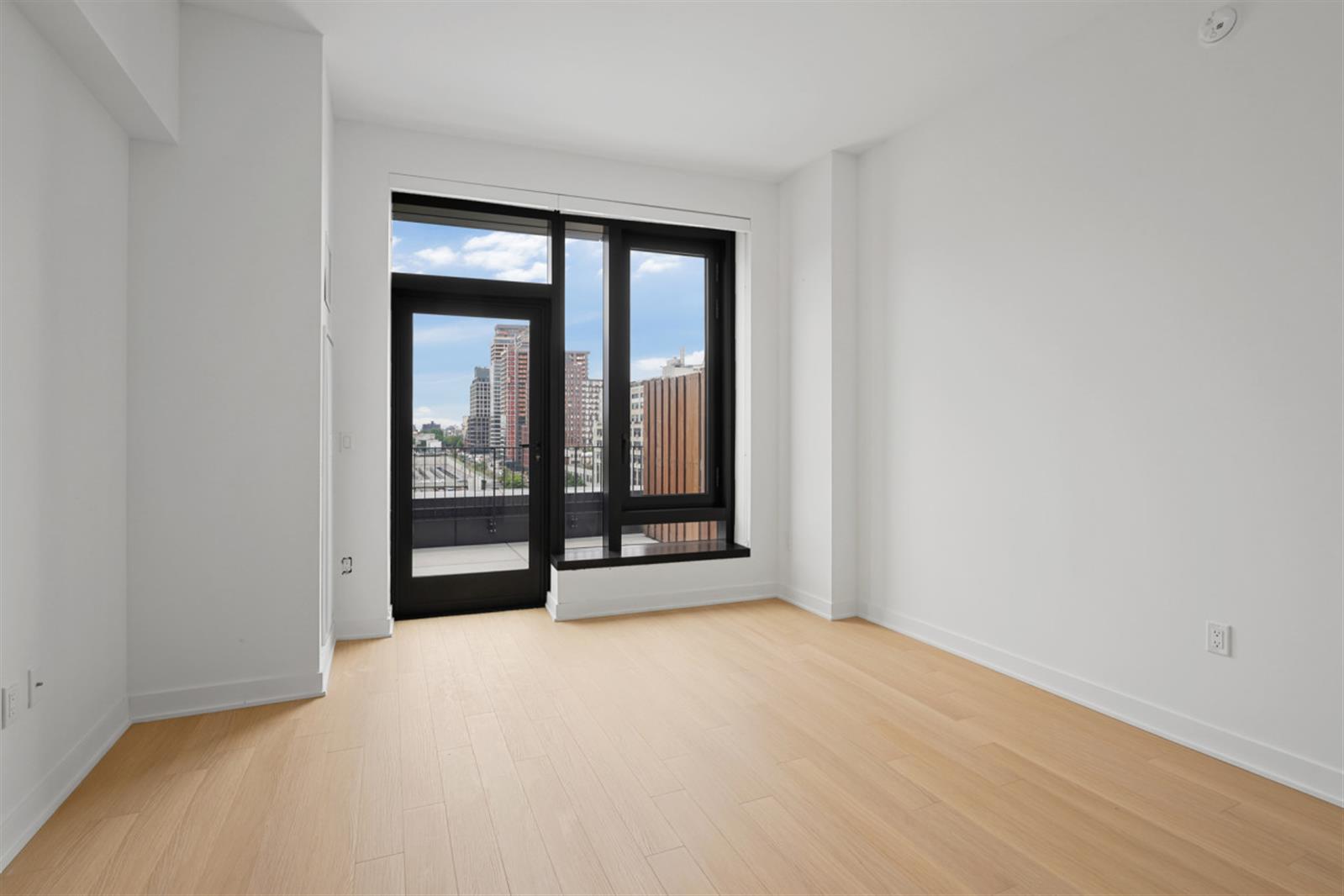 18 6th Avenue, Unit 711 Brooklyn, NY 11217 - Photo 25 of 35 a view of an empty room with glass door