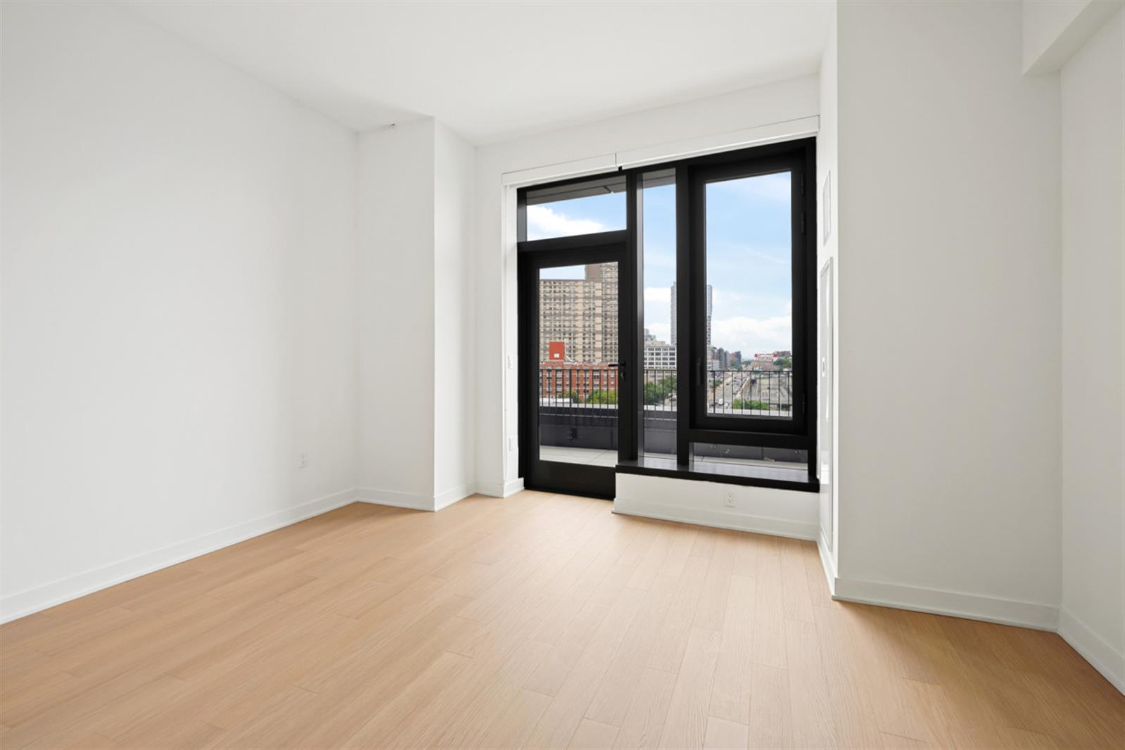 18 6th Avenue, Unit 711 Brooklyn, NY 11217 - Photo 26 of 35 wooden floor in an empty room with a window