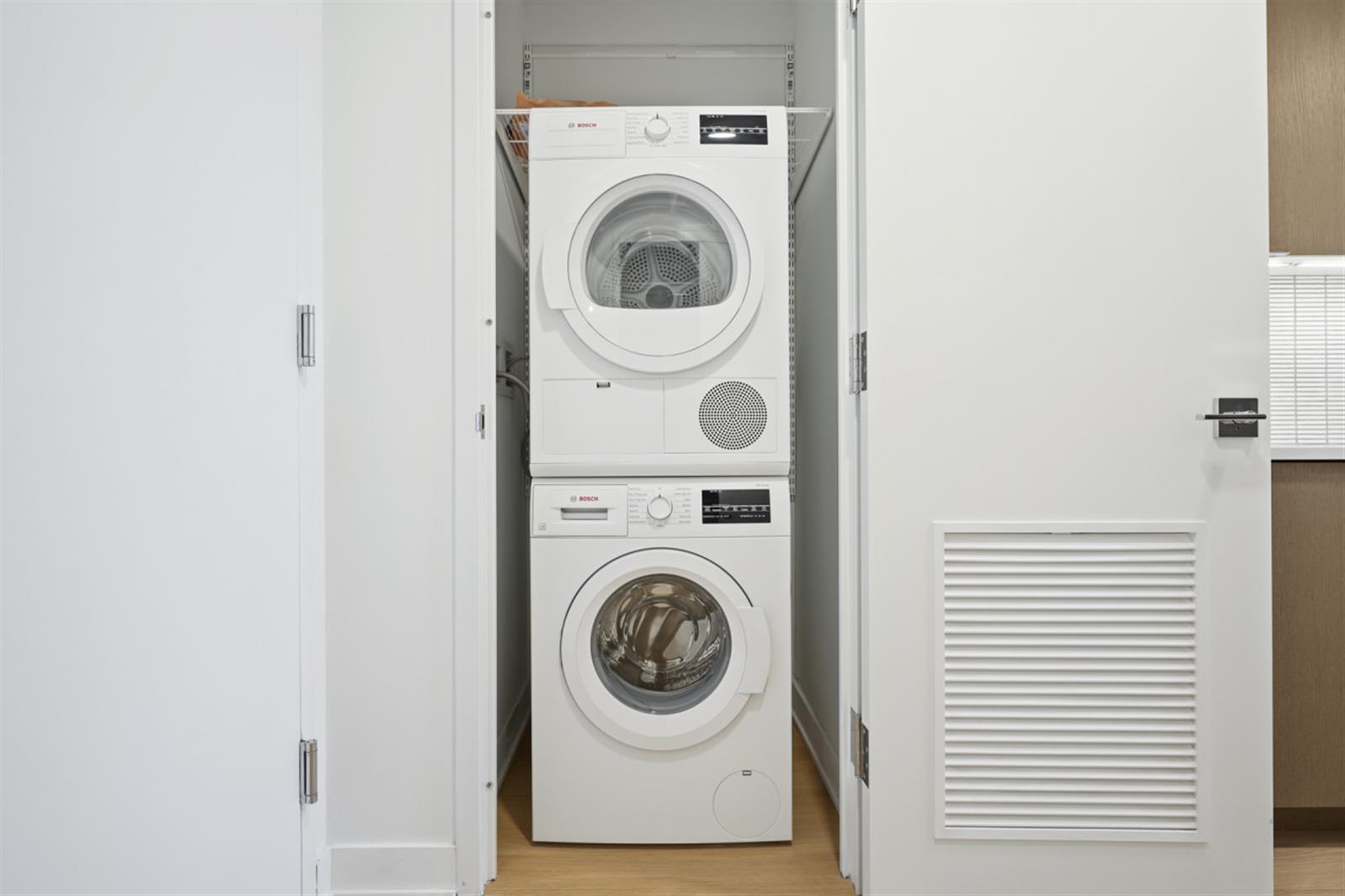18 6th Avenue, Unit 711 Brooklyn, NY 11217 - Photo 28 of 35 a utility room with dryer and washer