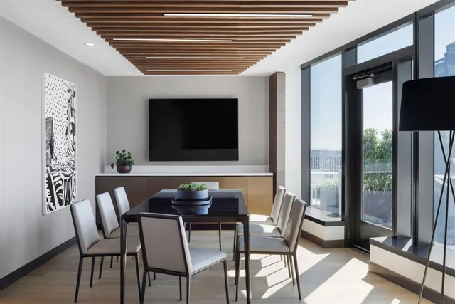 a dining room with furniture and window