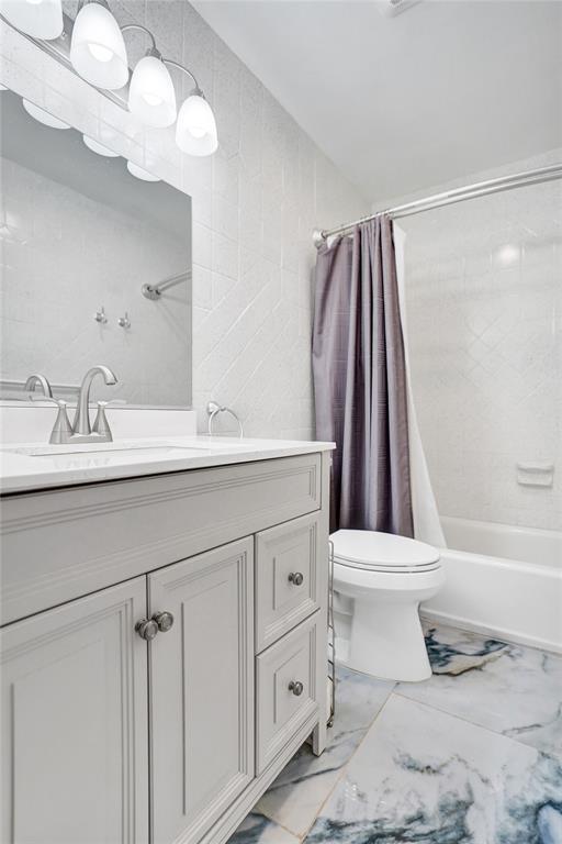 2330 Northeast 36th Street, Unit 9 Lighthouse Point, FL 33064 - Photo 38 of 48 a bathroom with a sink a toilet and a bathtub