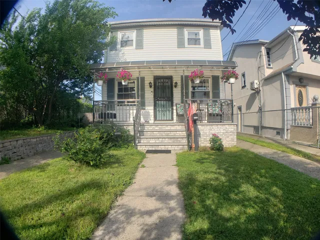 a view of a house with garden and plants