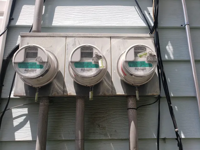 a living room with furniture a flat screen tv and a large window