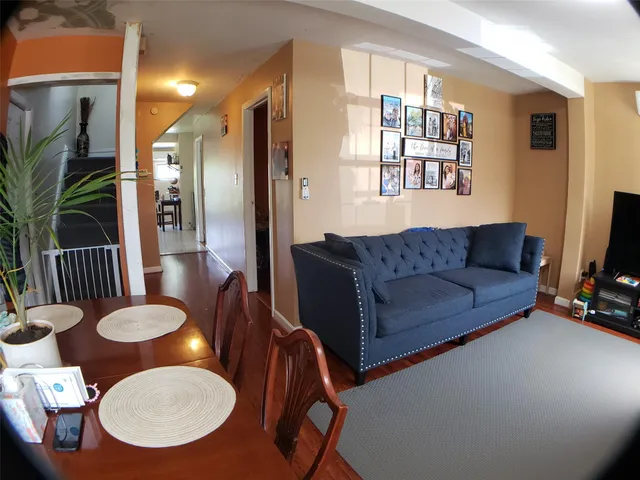 a very nice looking dining room with a table and chairs