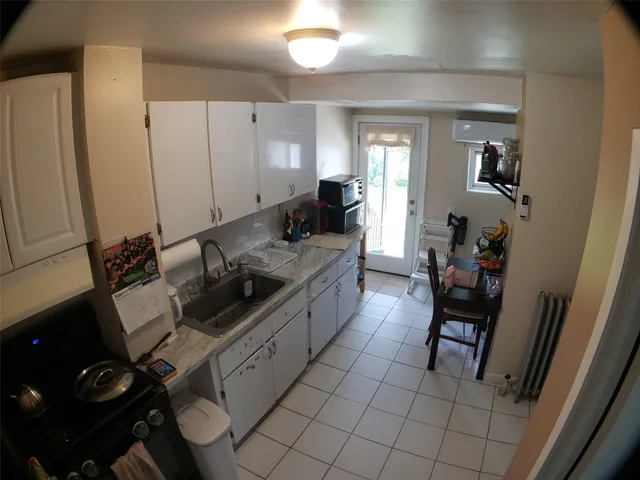 a bed room with a bed and a dresser