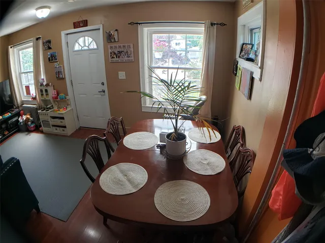 a bedroom with furniture and a wooden floor