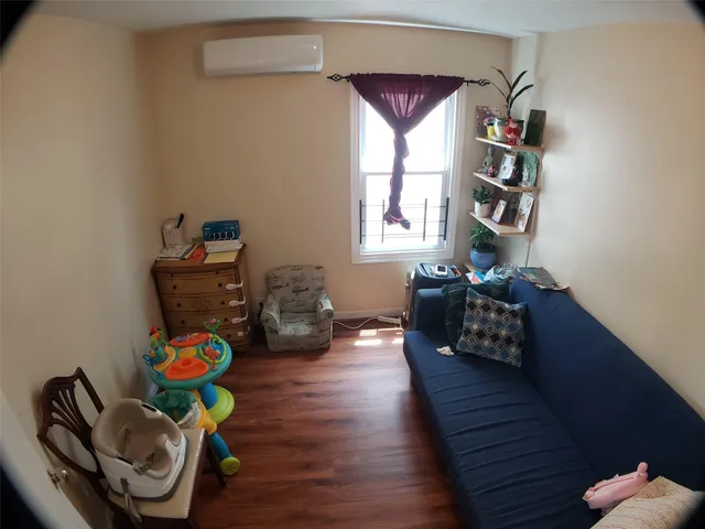 a view of staircase with white walls and a window