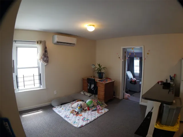 a room with furniture and window