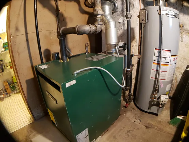 a view of a patio with table and chairs under an umbrella
