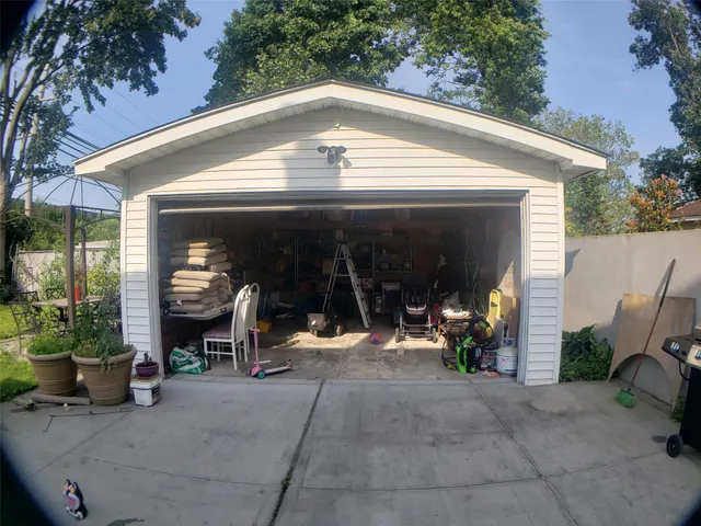 a front view of a house with fountain